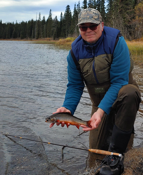Joe Warren fly fishing for brook trout in a lake